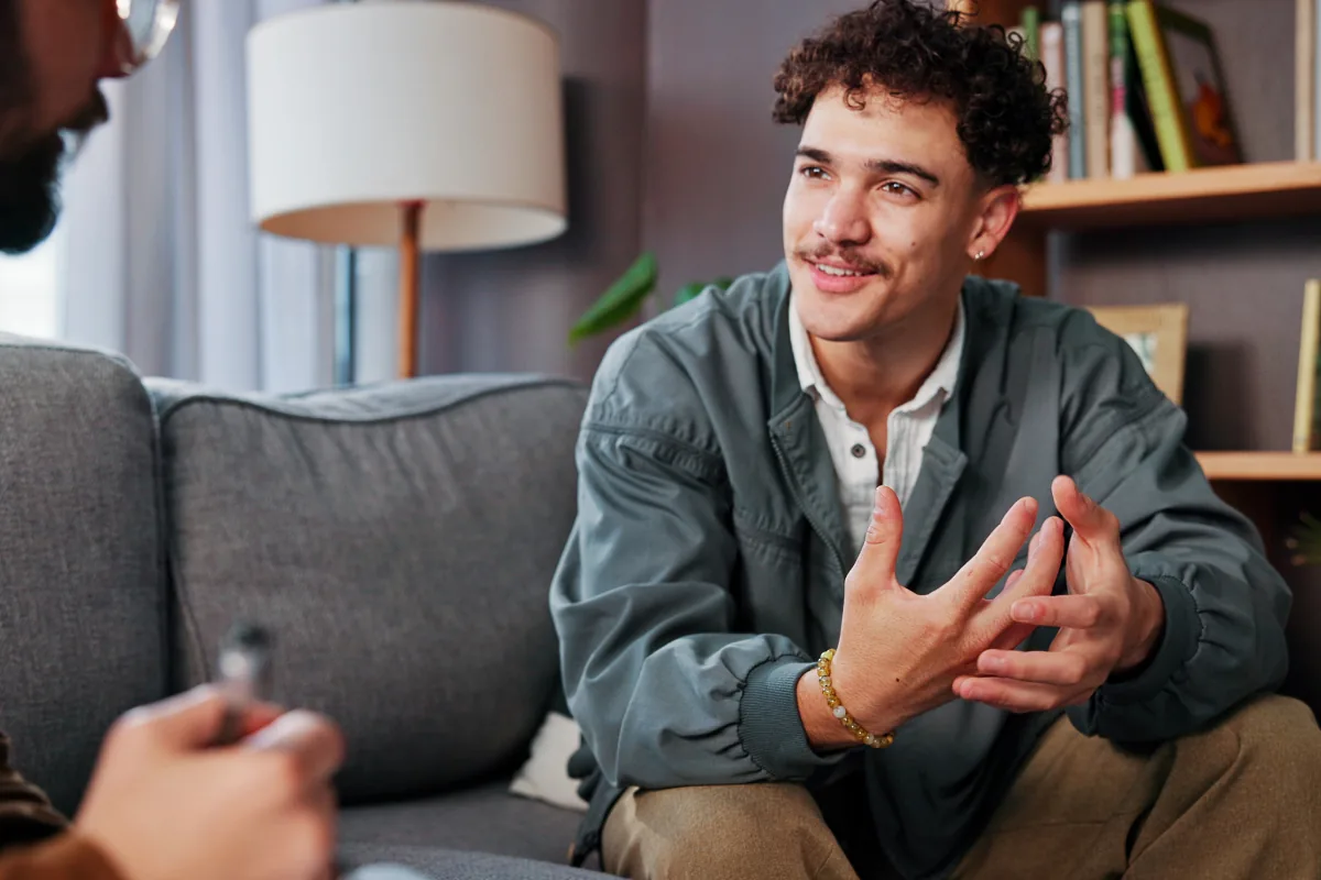 Clinician talking to a man about his mental health assessment to determine the patient's appropriate treatment level
