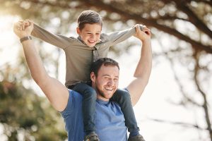 Father and son enjoying time outdoors, symbolizing family support during outpatient mental health treatment in Inland Empire.