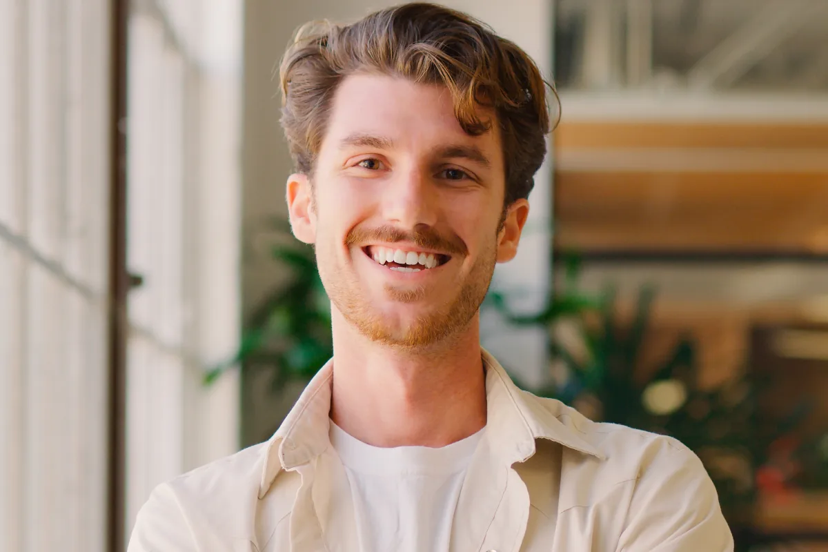 Man smiling at camera after transitioning from a partial hospitalization program to an intensive outpatient program